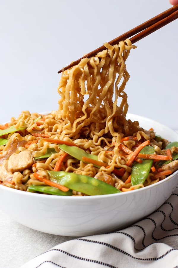 Dishing out ramen noodles with a pair of chopsticks