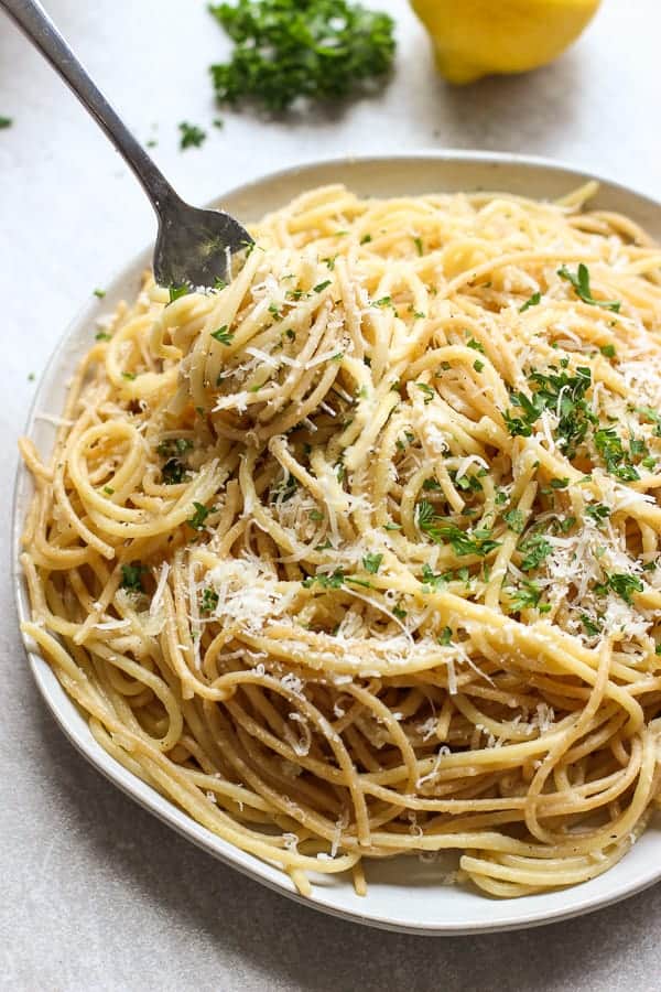 Fork digging into a plate of Lemon Garlic Parmesan Pasta