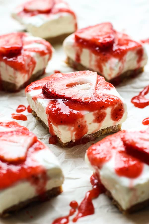 No Bake Cheesecake bite with sliced strawberry and strawberry sauce