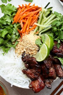 rice vermicelli noodles topped with veggies and grilled pork