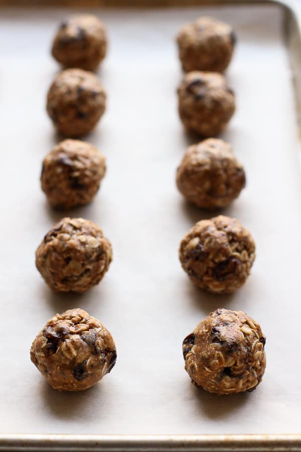 Lining energy balls on baking sheet line with parchment paper