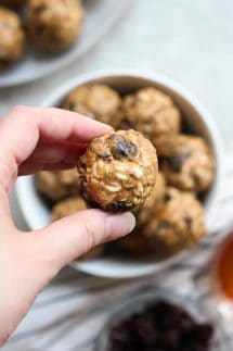 Holding up a Almond Butter Energy Ball