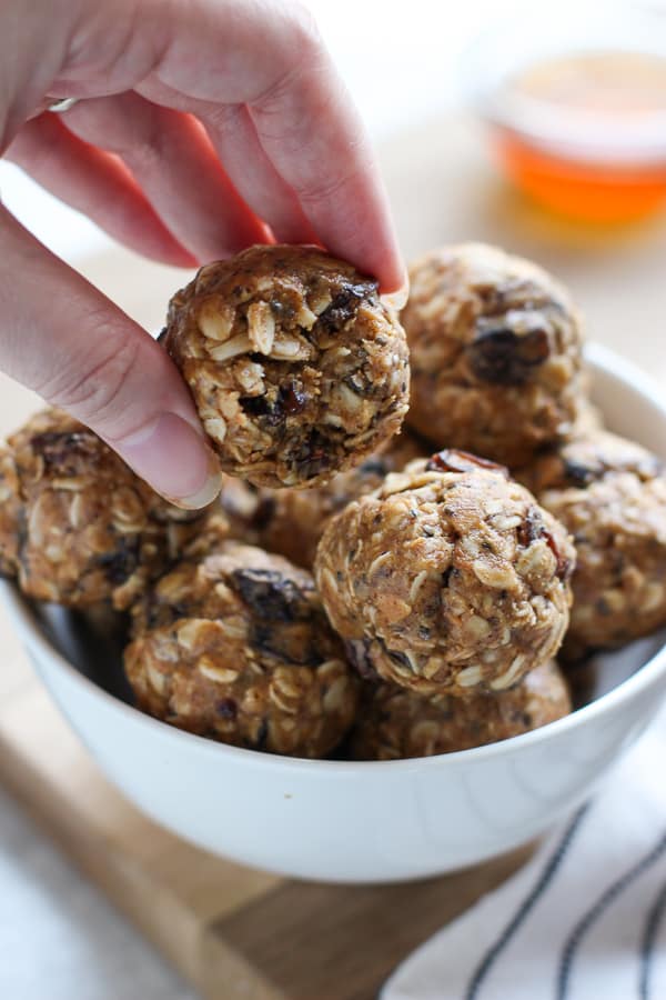 Holding up a No Bake Almond Butter Energy Balls