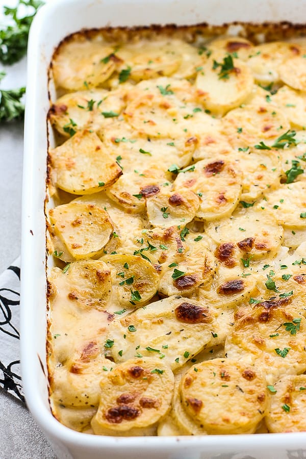 A rectangular casserole of Cheesy Garlic Scalloped Potatoes