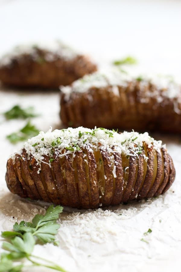 Russet potatoes drizzled with garlic, butter and parmesan cheese