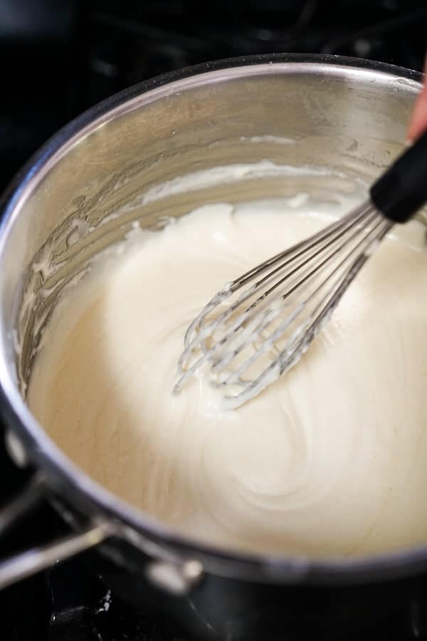 Whisking mixture in a pot