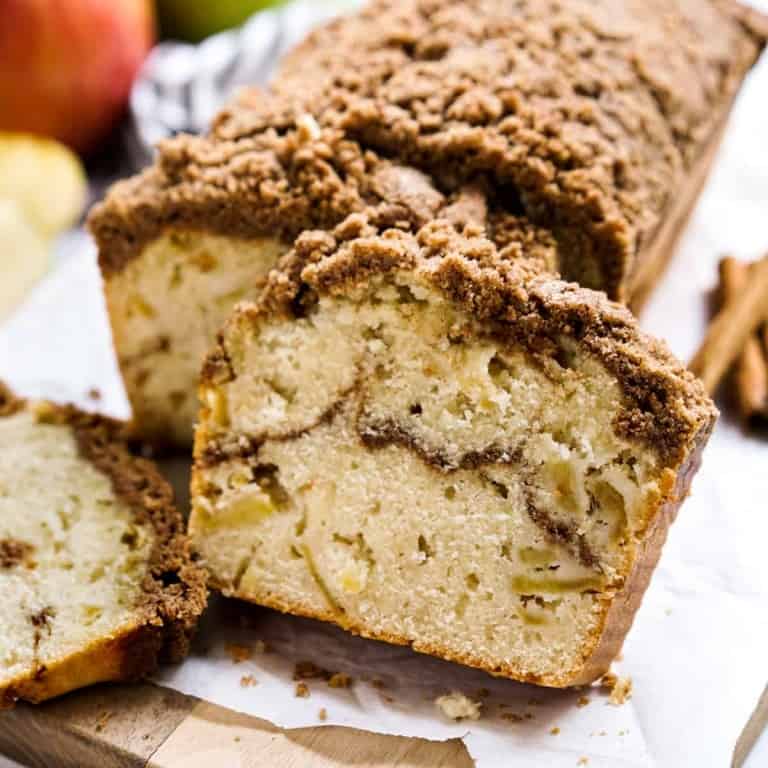 Slices of Apple Cinnamon Bread in front of a loaf