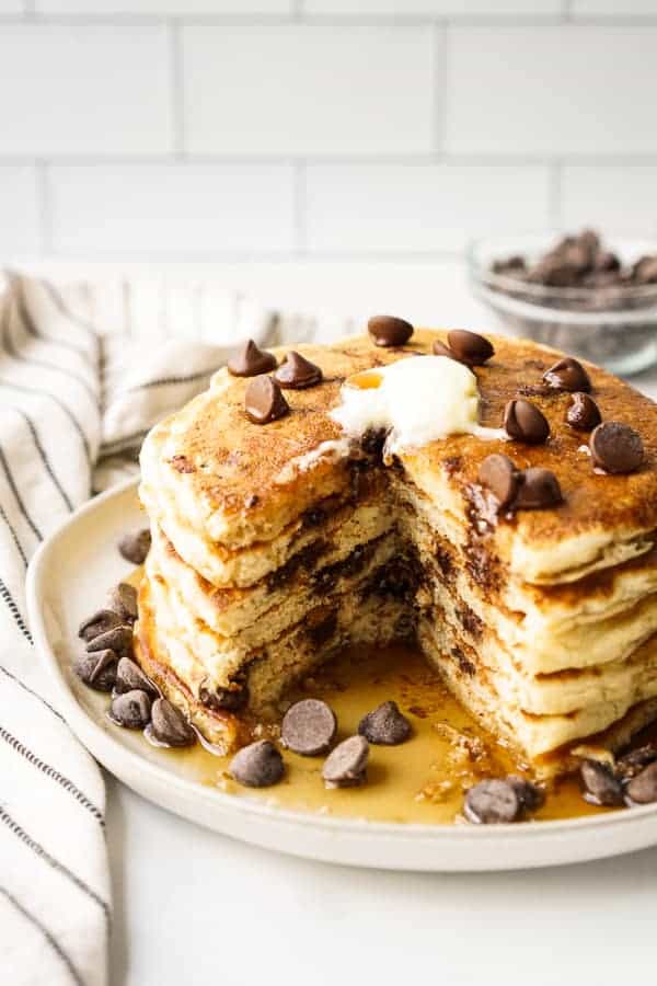 A stack of pancake with a small triangle cut out