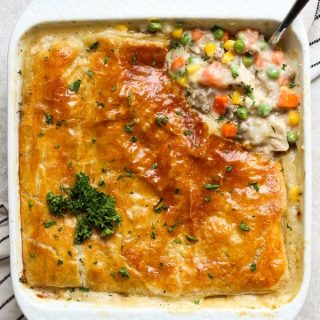 A top down view of chicken pot pie filling top with a layer of puff pastry