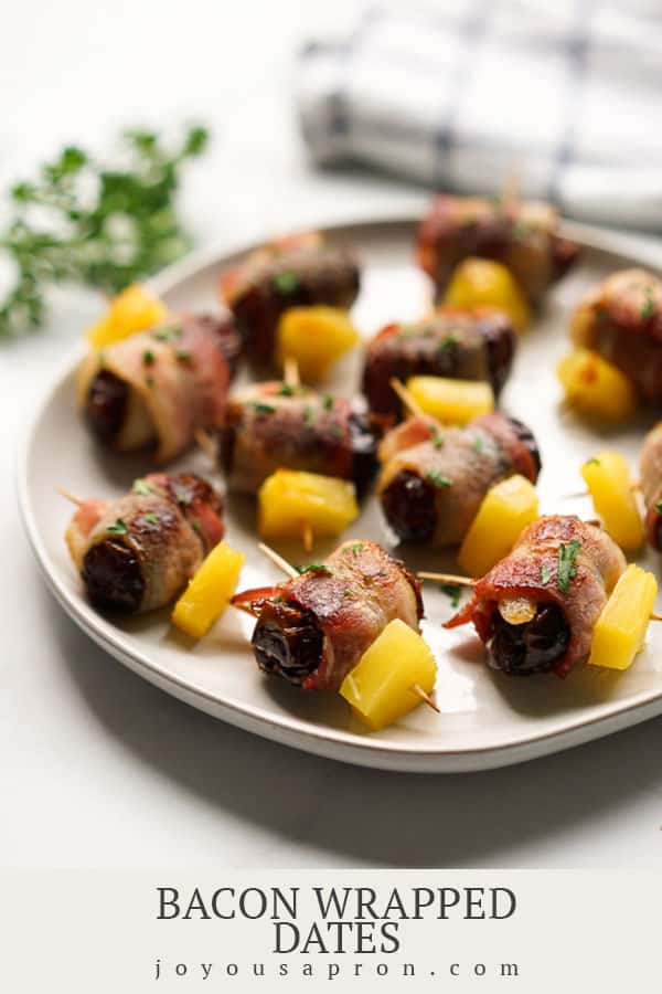 Bacon Wrapped Dates with Pineapple - yummy 3 ingredient easy appetizer and party food! Warm gooey dates wrapped with crispy bacon and topped with juicy pineapple. via @joyousapron