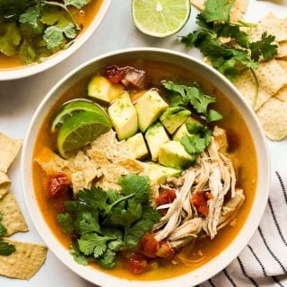 Top down view of a bowl of chicken tortilla soup
