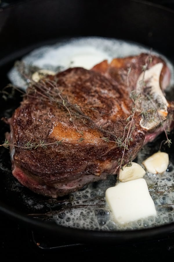 Searing steak with butter, garlic and fresh thyme