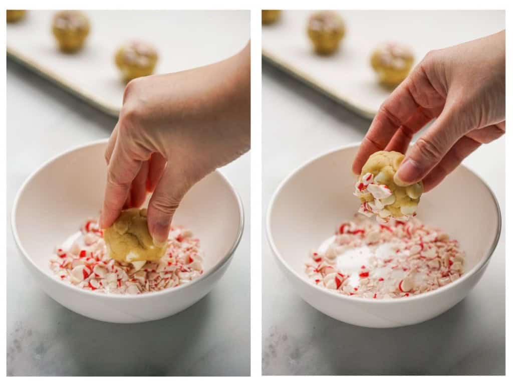 Dipping round cookie dough into crushed peppermint pieces