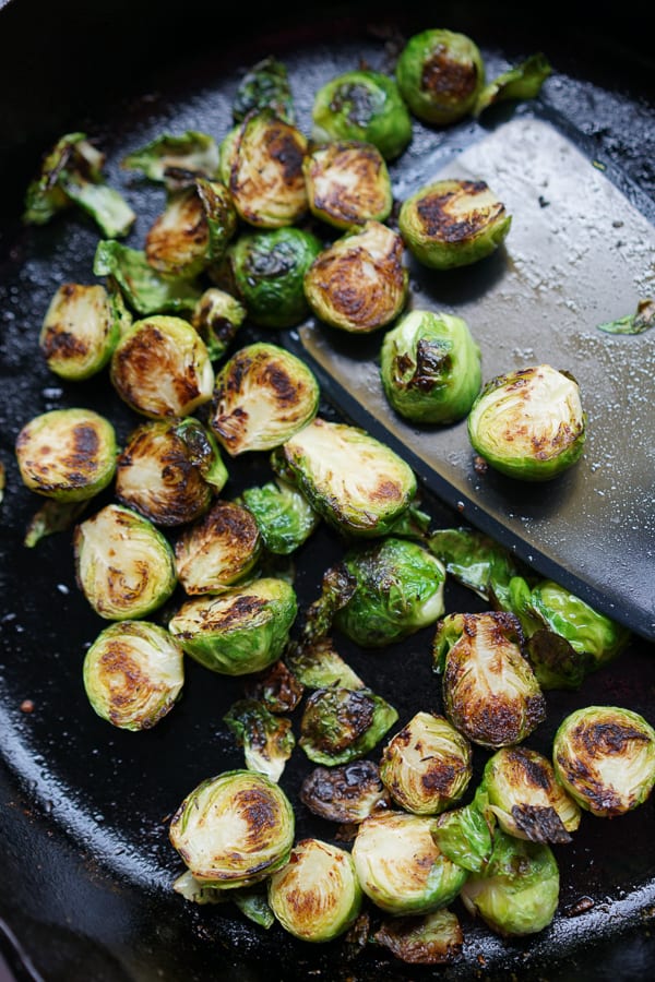 Sauteing Brussels sprouts on a cast iron skillet