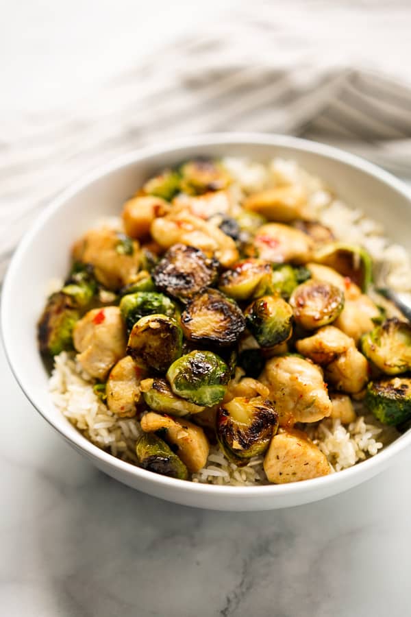 A bowl of brussels sprouts and chicken with rice