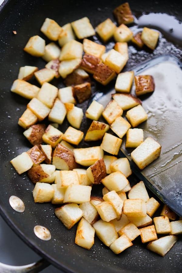 Searing diced red potatoes in skillet
