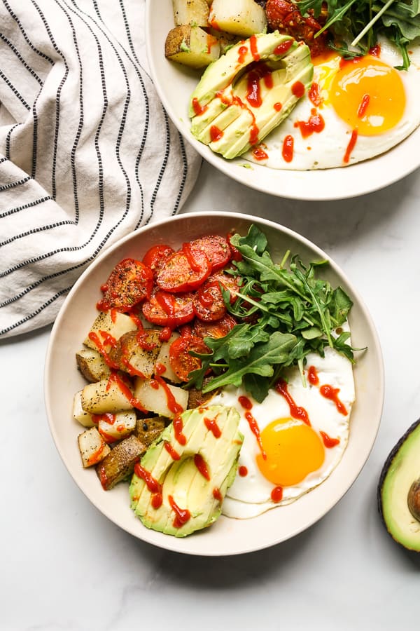 Top down view of two savory breakfast bowls