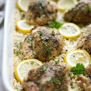 One Pan Baked Lemon Chicken and Rice in a rectangular casserole dish