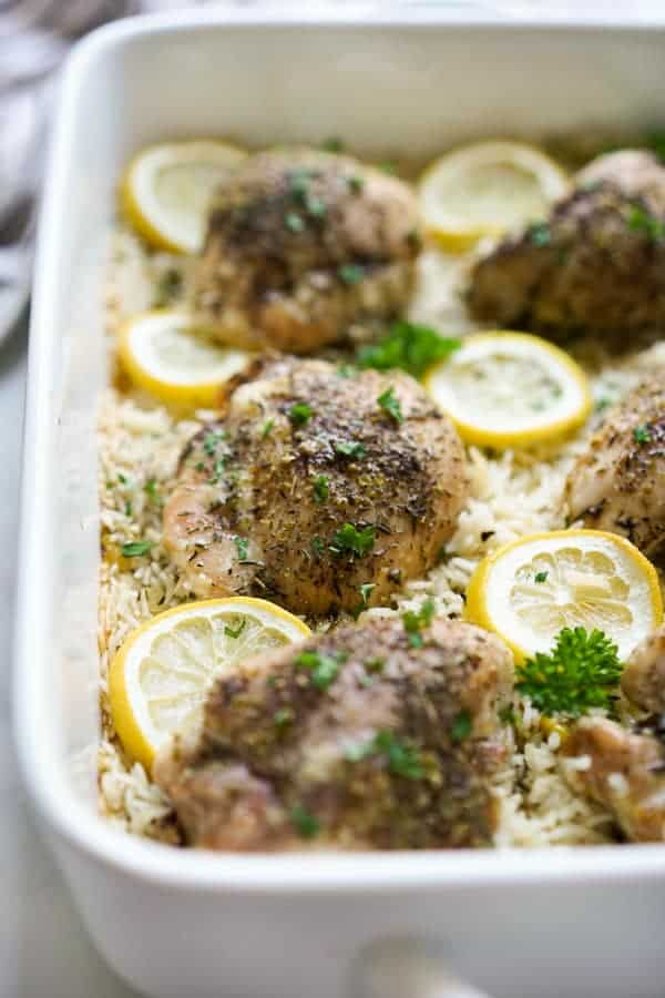 One Pan Baked Lemon Chicken and Rice in a rectangular casserole dish