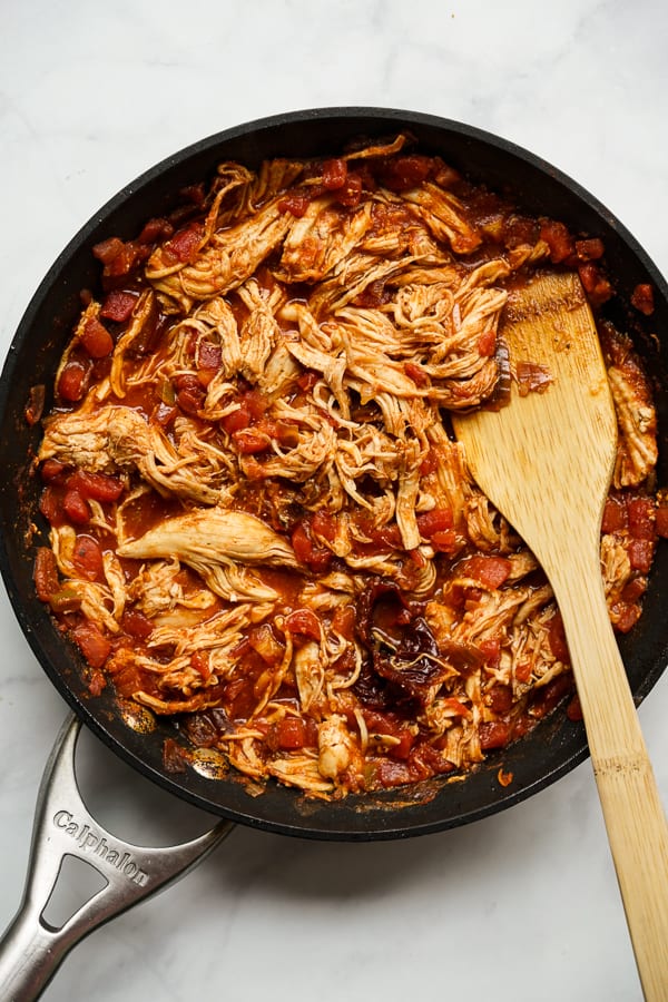 Cooking shredded chipotle chicken on a skillet