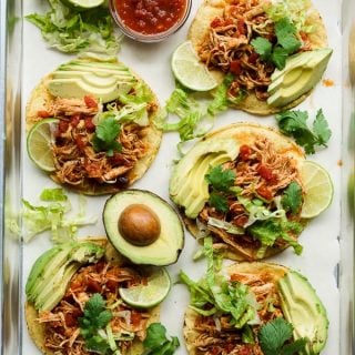 Flat lay view of chipotle chicken tostadas on a rectangular pan