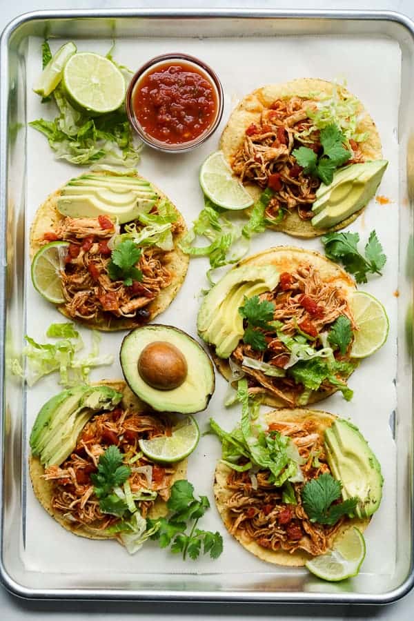 Flat lay view of chipotle chicken tostadas on a rectangular pan
