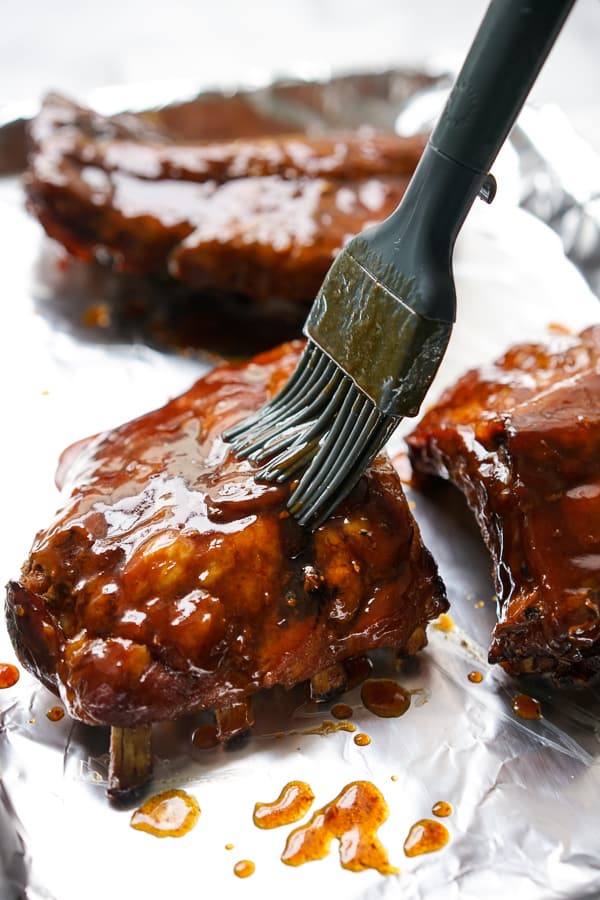 Brushing sauce onto Slow Cooker Asian Ribs