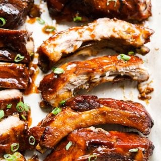 Sticky ribs lined up on a pan