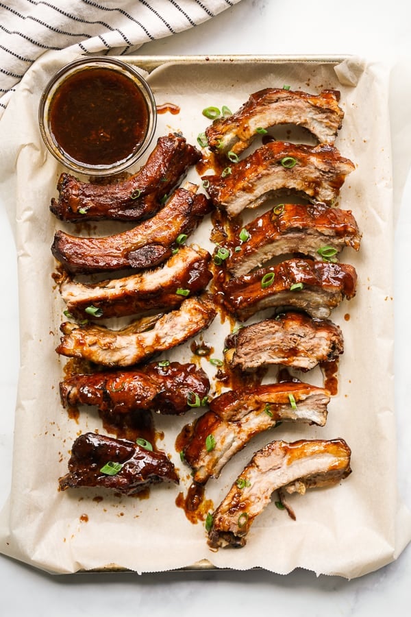 Top down view of Slow Cooker Asian Ribs on a pan lined with parchment paper