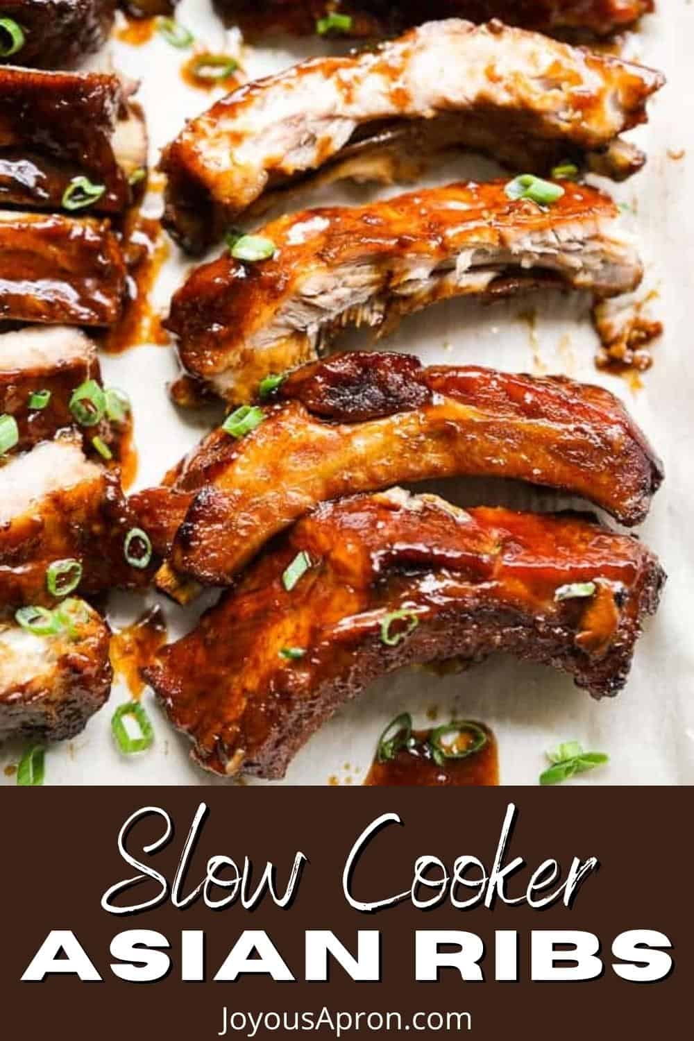 Slow Cooker Asian Ribs - tender baby back pork ribs coated with sticky Asian inspired sauce. Cooked in a slow cooker and then baked to perfection! A delicious crockpot recipe. via @joyousapron