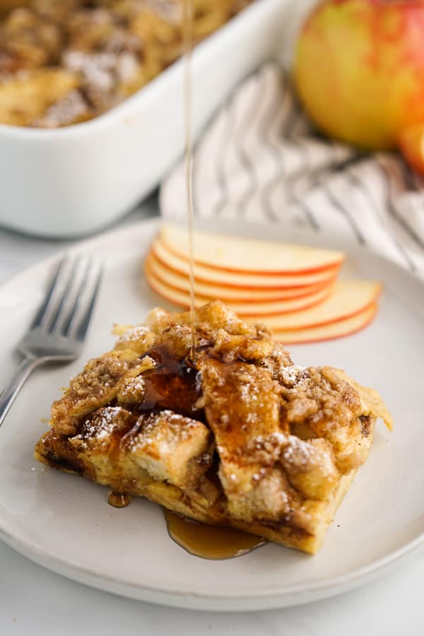 Drizzling maple syrup onto Apple French Toast