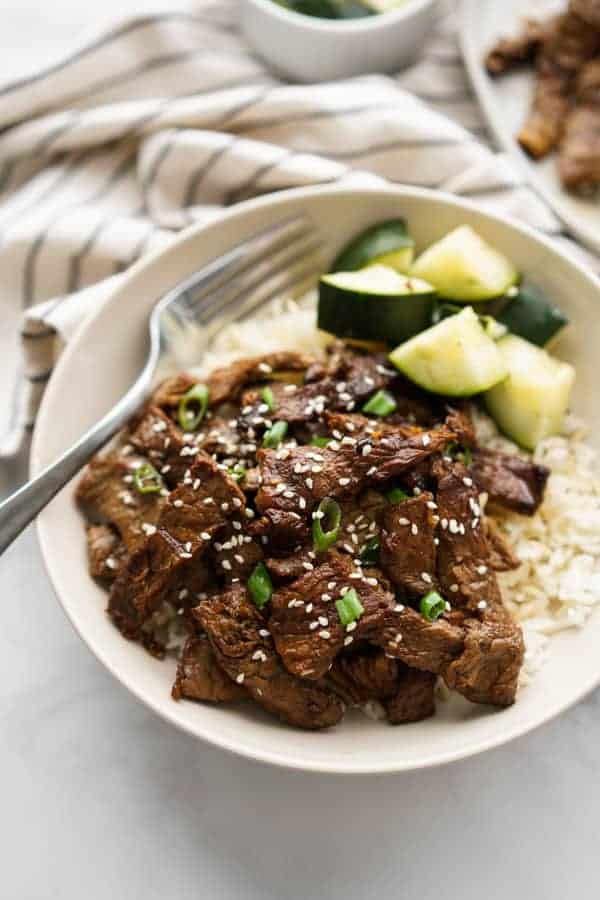 A bowl of beef bulgogi with fork