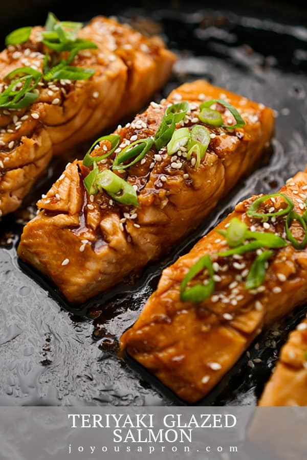 Teriyaki Salmon - Asian inspired pan fried salmon recipe on a skillet, coated in homemade teriyaki sauce. Healthy, easy and tasty weeknight dinner option. via @joyousapron