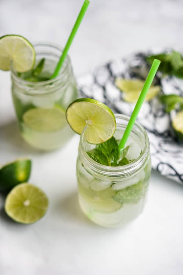Two mason jars filled with sparkling lime juice