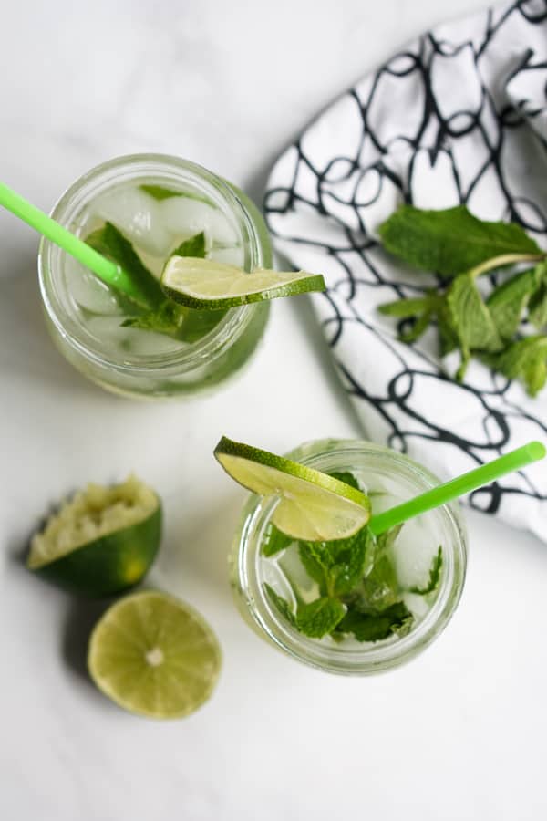 Two down view of two drinks with straws in them