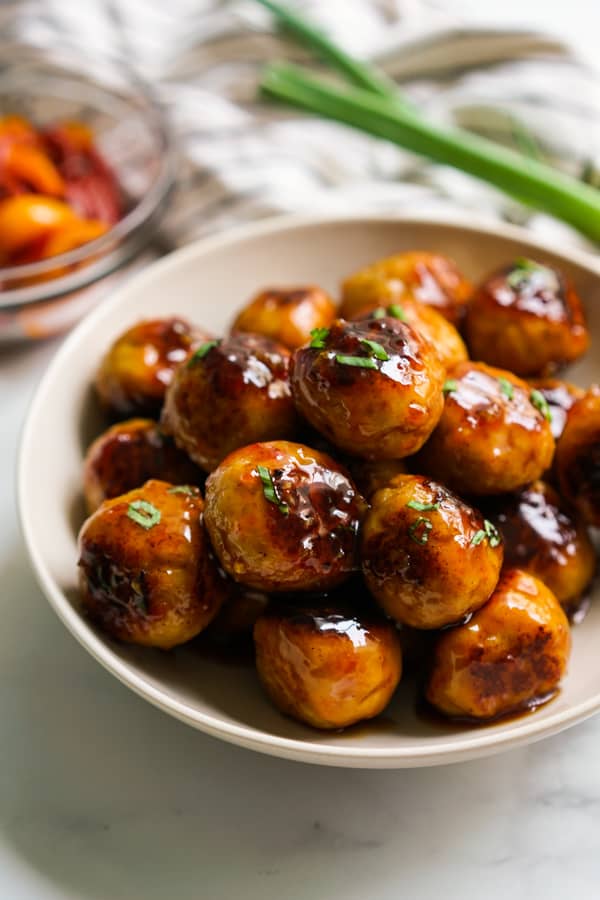 A bowl of sweet and sour chicken meatballs