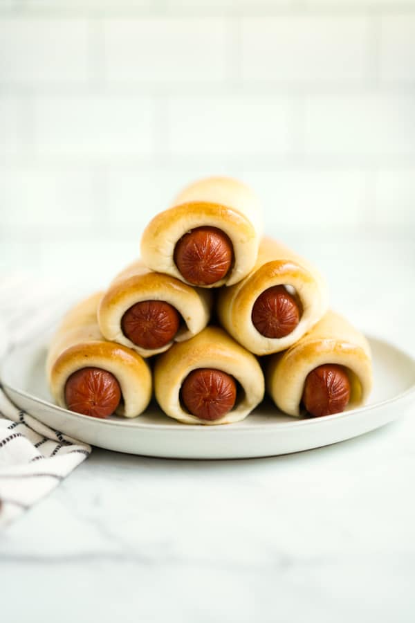 Texas Sausage Kolaches stacked on a plate