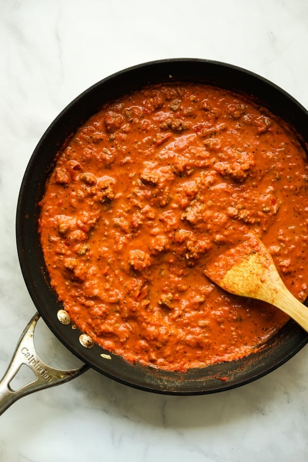 Creamy tomato sauce with Italian sausage in a large round skillet