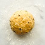 Rolled scones dough into a ball on floured surface