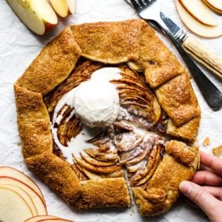 Hand grabbing a slice of apple cinnamon galette