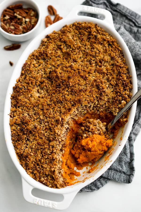 Spoon scooping out Sweet Potato Casserole