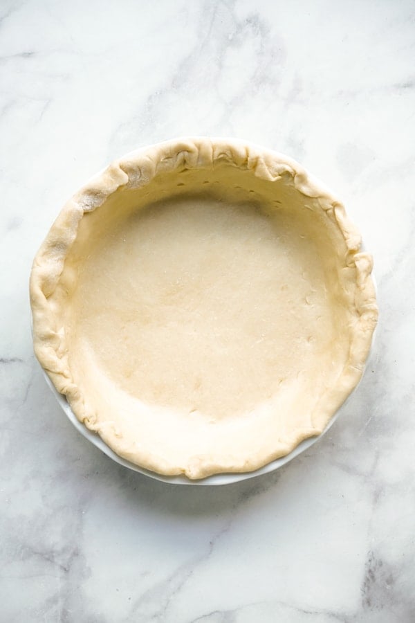 Unbaked pie crust on pie pan