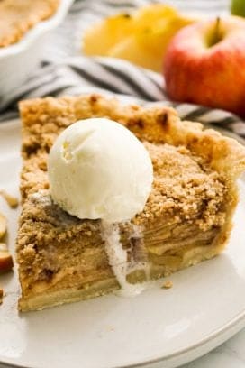 Apple crumble pie topped with vanilla ice cream