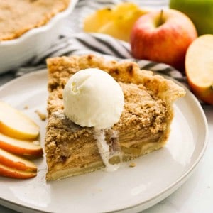 Apple crumble pie topped with vanilla ice cream