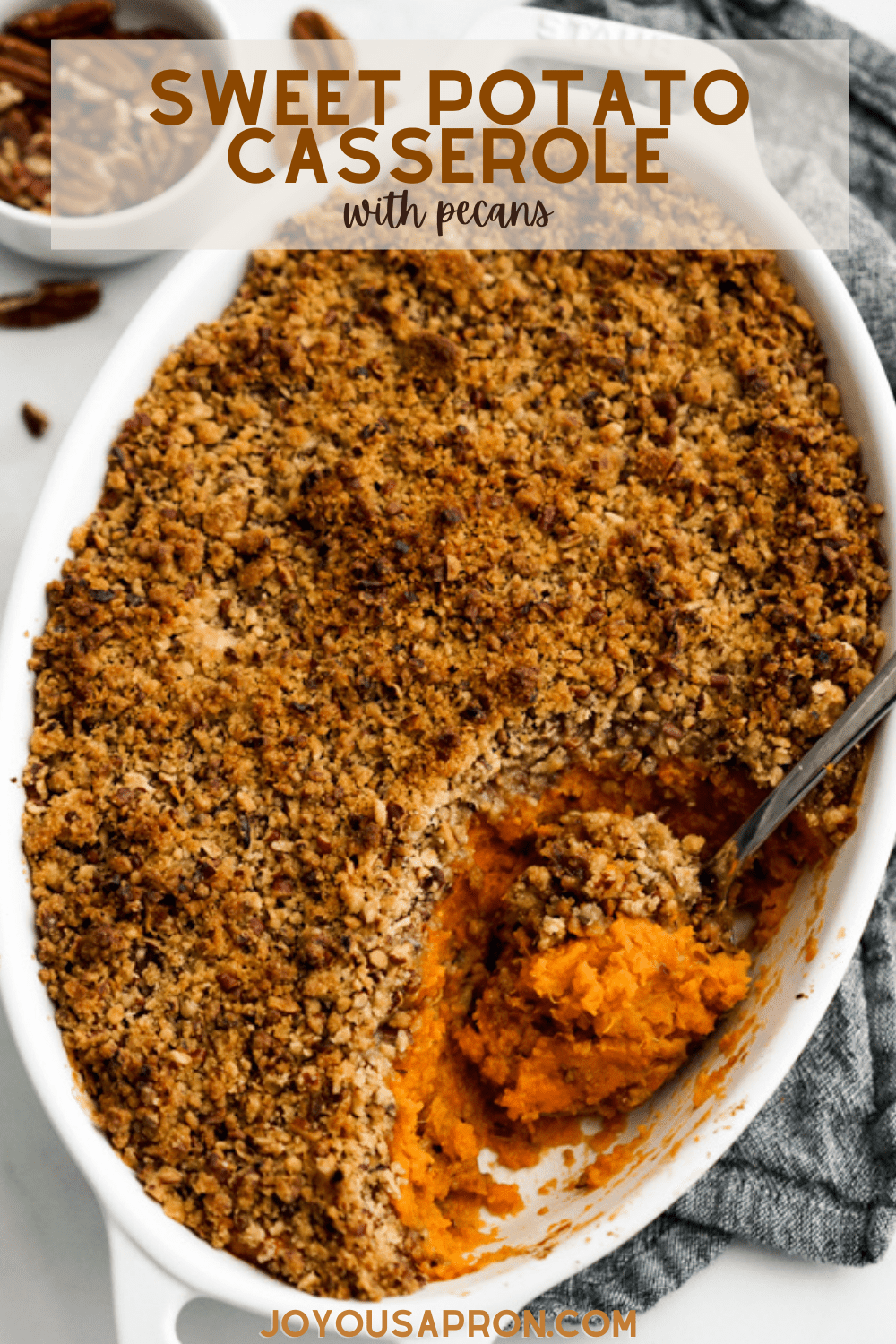 Sweet Potato Casserole with Pecans - a classic Thanksgiving and Christmas holiday side dish recipe. Flavorful and smooth mashed sweet potatoes topped with a pecan crusted crumble and baked to perfection. via @joyousapron