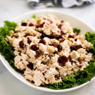 A plate of turkey salad tossed in mayo and cranberries
