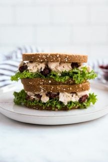 Two pieces of turkey salad sandwiches stacked on top of each other