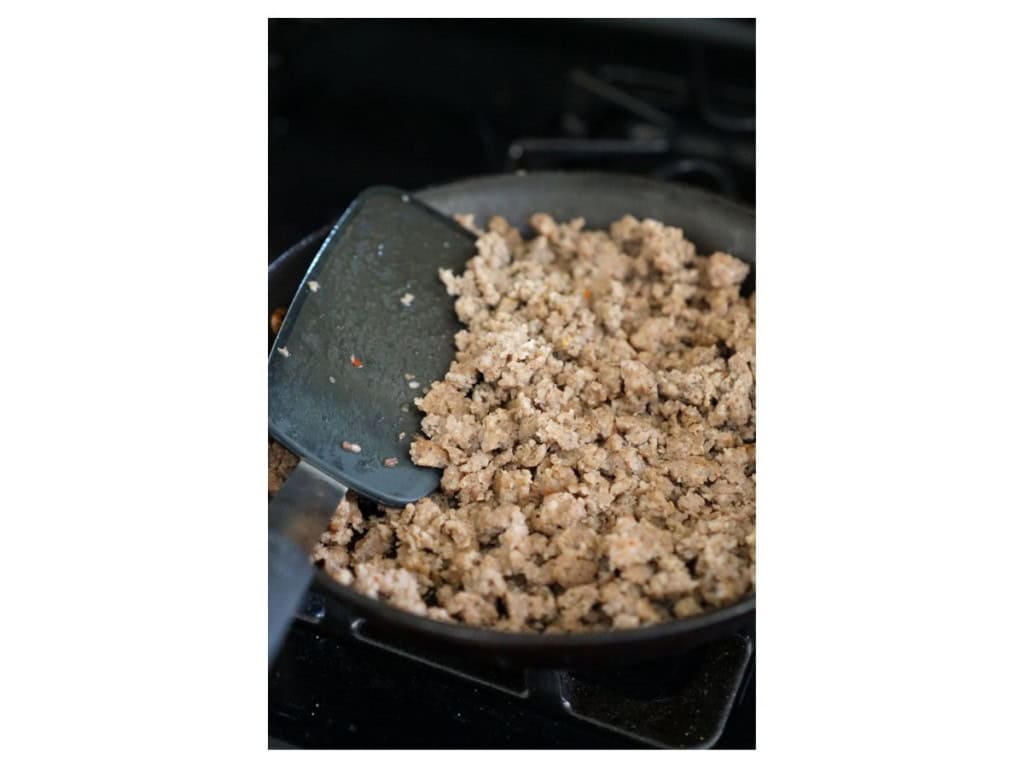 Searing crumble sausage on a skillet