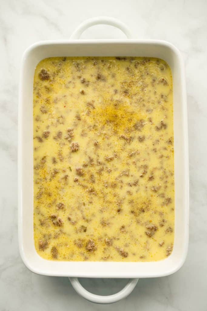 Eggs and ground sausage in a casserole dish