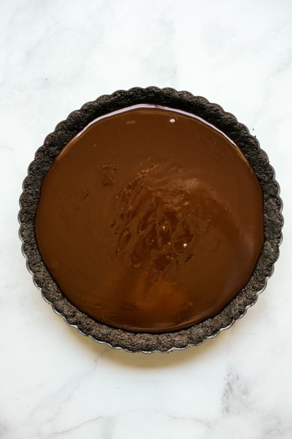 Tart pan with Oreo crust and chocolate filling